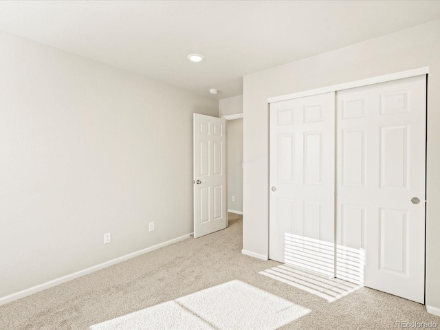 20982 E 66th Ave, Aurora, CO 80019 - unfurnished bedroom featuring carpet floors, a closet, and baseboards