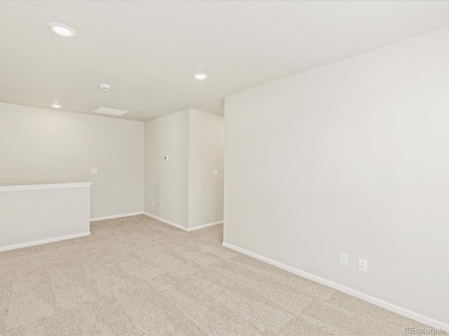 20982 E 66th Ave, Aurora, CO 80019 - empty room featuring baseboards, light carpet, and recessed lighting