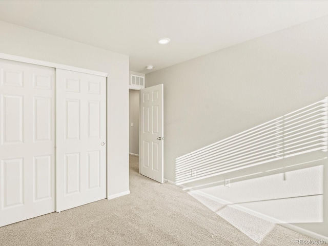20982 E 66th Ave, Aurora, CO 80019 - unfurnished bedroom with a closet, carpet floors, visible vents, and baseboards