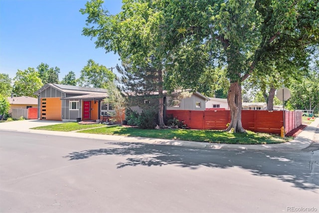 5480 W Iowa Ave, Lakewood, CO 80232 - view of front of house featuring driveway and a garage