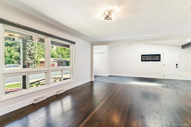 5480 W Iowa Ave, Lakewood, CO 80232 - unfurnished living room featuring wood finished floors