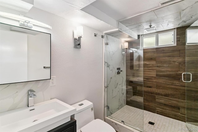 5480 W Iowa Ave, Lakewood, CO 80232 - full bathroom with vanity, a shower stall, and a textured wall