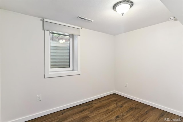5480 W Iowa Ave, Lakewood, CO 80232 - empty room featuring dark wood-style flooring and a smoke detector