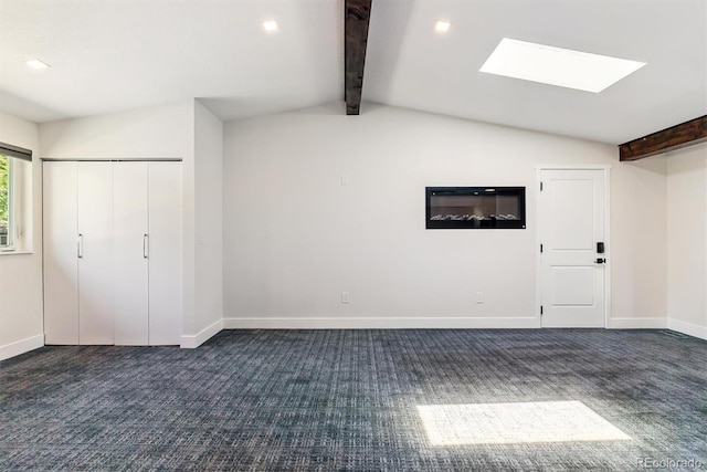 5480 W Iowa Ave, Lakewood, CO 80232 - unfurnished living room featuring dark carpet, a skylight, and recessed lighting