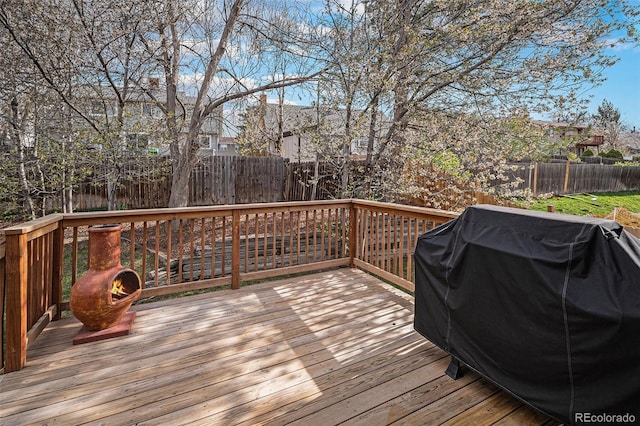 7746 W Quarto Dr, Littleton, CO 80128 - wooden deck with a grill and fence