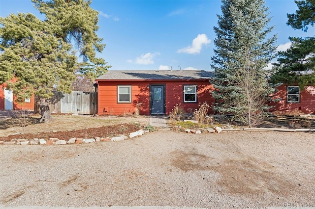 view of front of house featuring fence