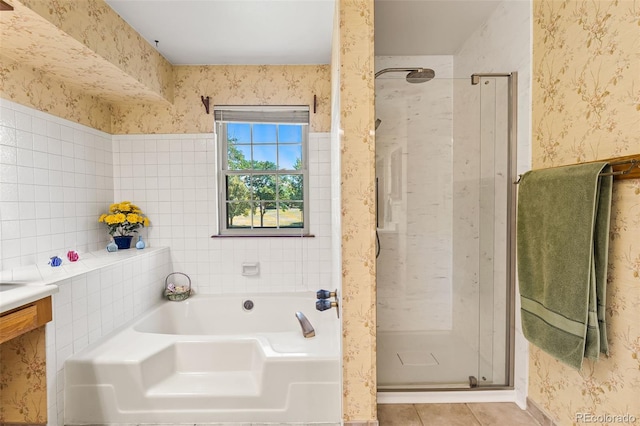 16085 E Lehigh Cir, Aurora, CO 80013 - full bathroom with wallpapered walls, a shower stall, a bath, and tile patterned floors