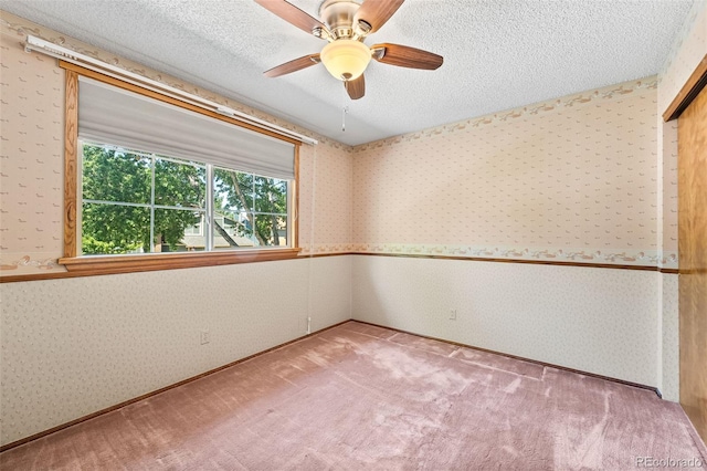 16085 E Lehigh Cir, Aurora, CO 80013 - carpeted spare room with wallpapered walls, a ceiling fan, and a textured ceiling
