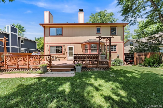 16085 E Lehigh Cir, Aurora, CO 80013 - back of property with a wooden deck and a chimney