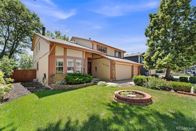16085 E Lehigh Cir, Aurora, CO 80013 - view of front facade with brick siding, driveway, and an attached garage