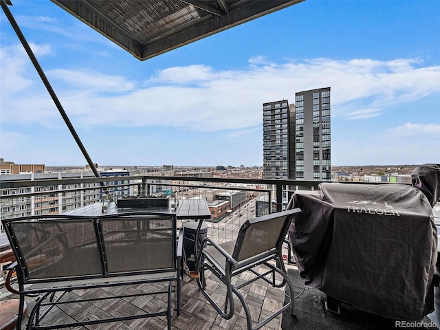 balcony featuring a grill and a city view