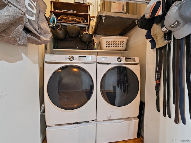 laundry room with washing machine and clothes dryer and laundry area