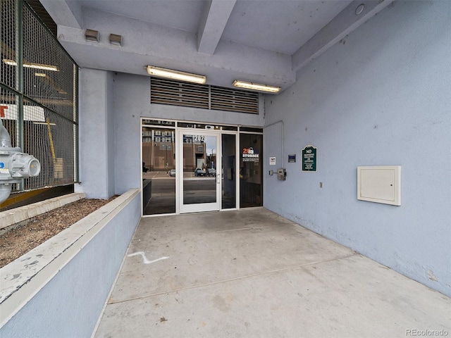 property entrance featuring a patio area