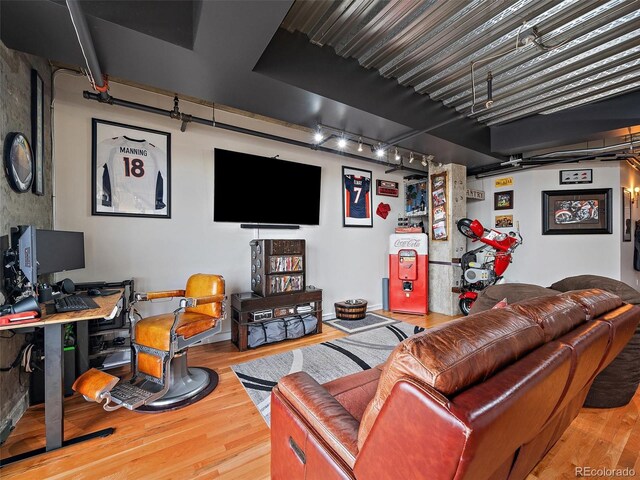2020 Arapahoe St Unit 1150, Denver, CO 80205 - living area with rail lighting and wood finished floors