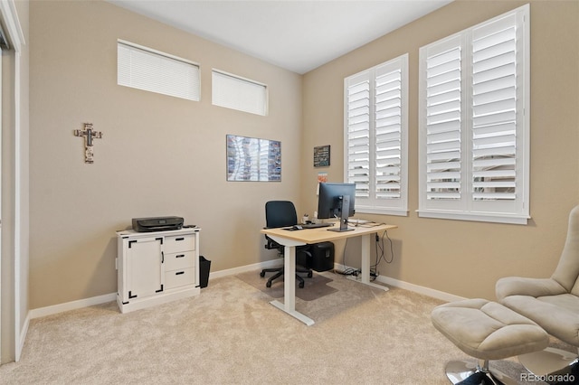 carpeted home office with baseboards