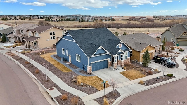 birds eye view of property with a residential view