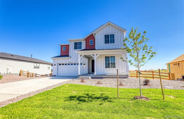 view of front of house with a front yard and a garage