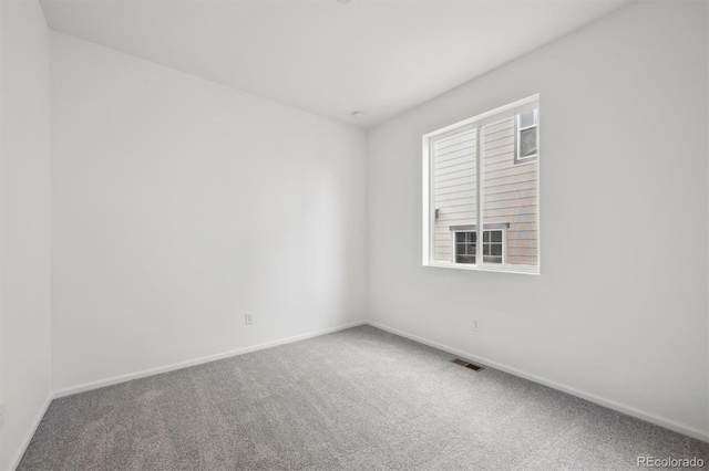 6625 N Nepal St, Aurora, CO 80019 - carpeted spare room with baseboards and visible vents