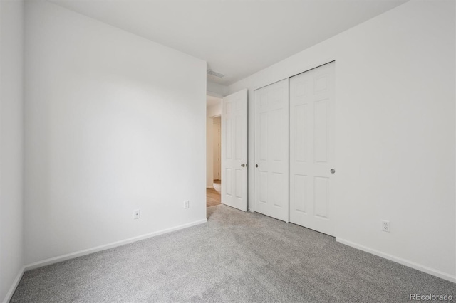 6625 N Nepal St, Aurora, CO 80019 - unfurnished bedroom featuring baseboards, visible vents, a closet, and carpet flooring