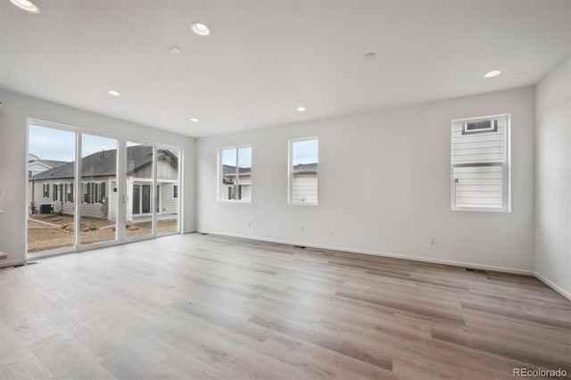 6625 N Nepal St, Aurora, CO 80019 - empty room featuring wood finished floors and recessed lighting