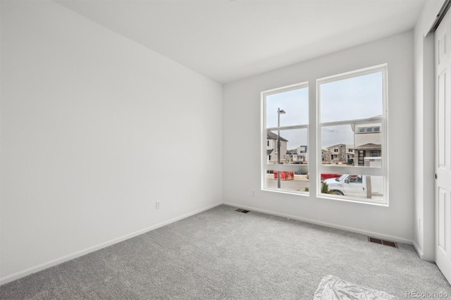 6625 N Nepal St, Aurora, CO 80019 - carpeted empty room with baseboards and visible vents