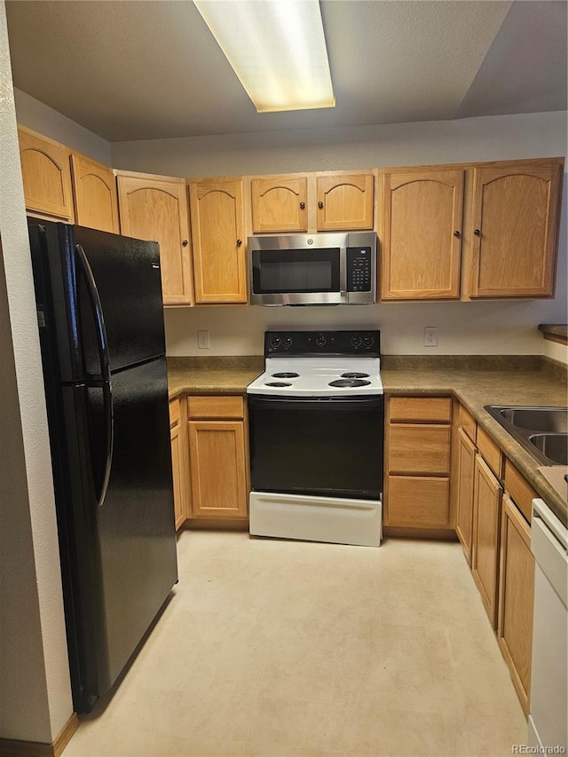 kitchen with sink and white appliances