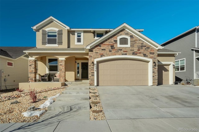 craftsman inspired home featuring driveway, a porch, an attached garage, and stucco siding