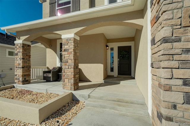 property entrance featuring covered porch