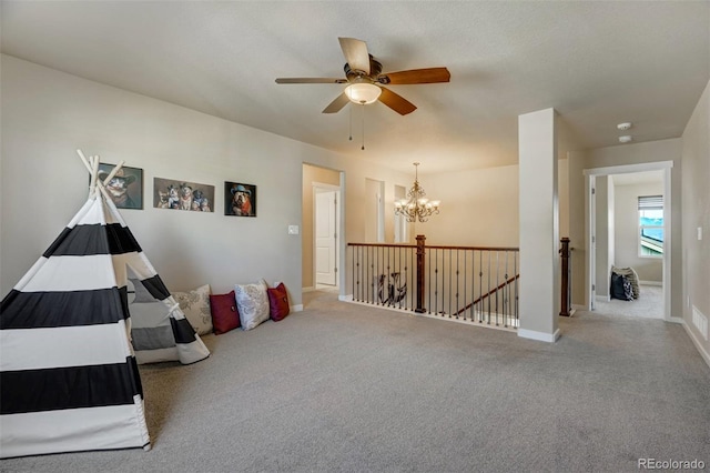 playroom with light carpet and an inviting chandelier