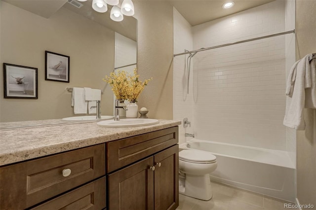 bathroom featuring washtub / shower combination, vanity, toilet, and tile patterned floors