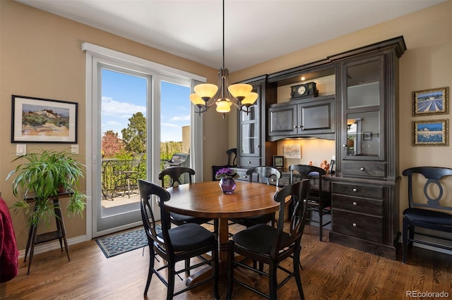 4373 E Phillips Pl, Centennial, CO 80122 - dining space featuring baseboards, a chandelier, and dark wood finished floors