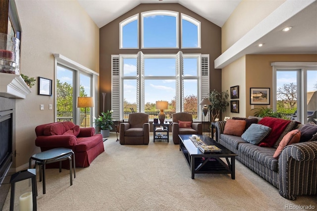 4373 E Phillips Pl, Centennial, CO 80122 - living area with a fireplace, high vaulted ceiling, carpet, and recessed lighting