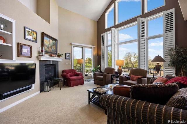 4373 E Phillips Pl, Centennial, CO 80122 - living room featuring carpet flooring, high vaulted ceiling, plenty of natural light, and a fireplace