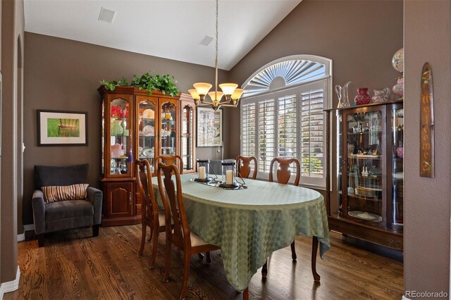 4373 E Phillips Pl, Centennial, CO 80122 - dining area featuring wood finished floors, a notable chandelier, and high vaulted ceiling