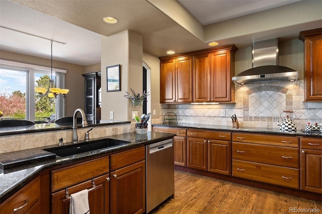 4373 E Phillips Pl, Centennial, CO 80122 - kitchen with wall chimney range hood, brown cabinetry, light wood-type flooring, dishwasher, and a sink