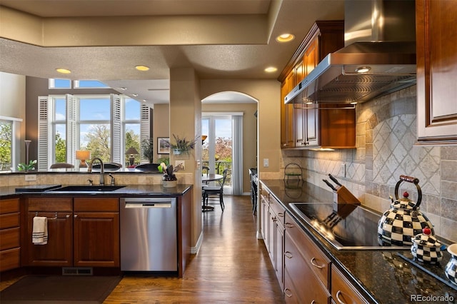 4373 E Phillips Pl, Centennial, CO 80122 - kitchen with a sink, dishwasher, arched walkways, wall chimney exhaust hood, and dark wood-style floors