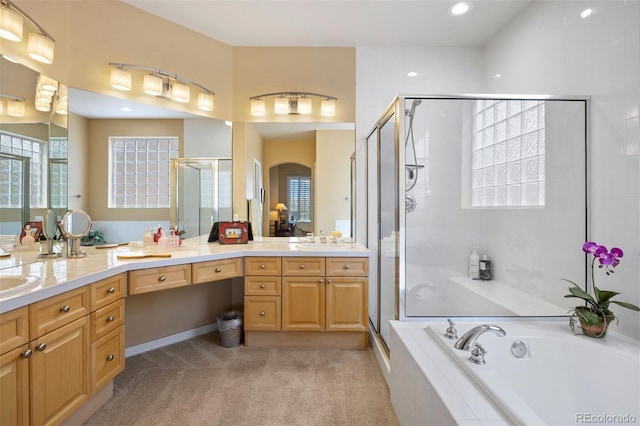 4373 E Phillips Pl, Centennial, CO 80122 - bathroom with a garden tub, double vanity, recessed lighting, a shower stall, and a sink