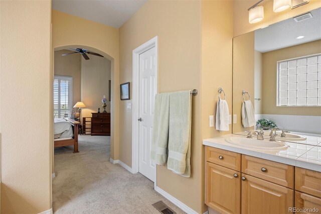 4373 E Phillips Pl, Centennial, CO 80122 - bathroom featuring ensuite bath, a ceiling fan, visible vents, and vanity