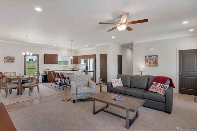 6986 Marshbern Ct, Colorado Springs, CO 80908 - living room featuring recessed lighting, ornamental molding, and ceiling fan