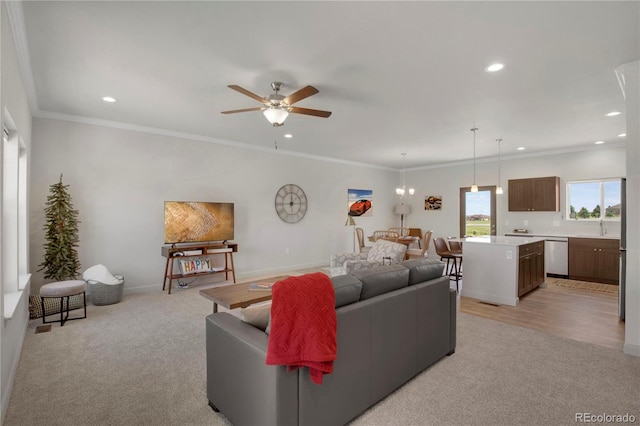 6986 Marshbern Ct, Colorado Springs, CO 80908 - living room with recessed lighting, light colored carpet, a ceiling fan, and ornamental molding
