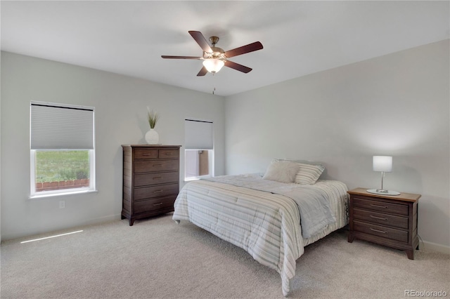 6986 Marshbern Ct, Colorado Springs, CO 80908 - bedroom with light carpet and ceiling fan