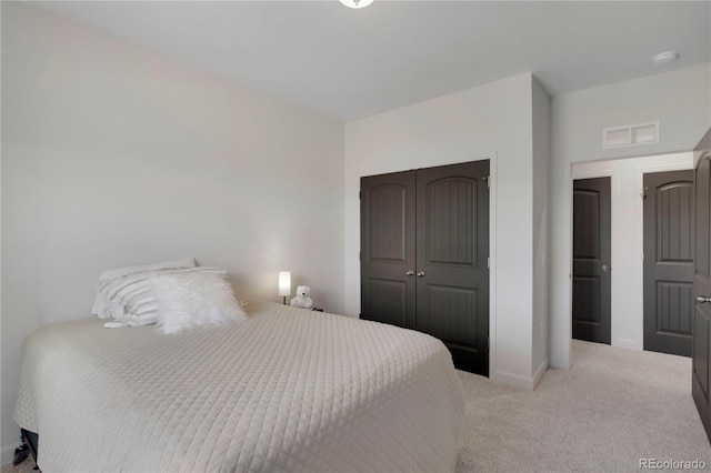 6986 Marshbern Ct, Colorado Springs, CO 80908 - carpeted bedroom with baseboards and a closet