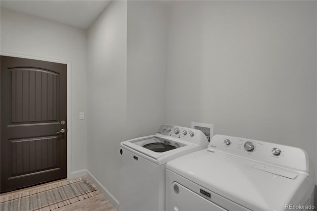 6986 Marshbern Ct, Colorado Springs, CO 80908 - washroom featuring separate washer and dryer and baseboards