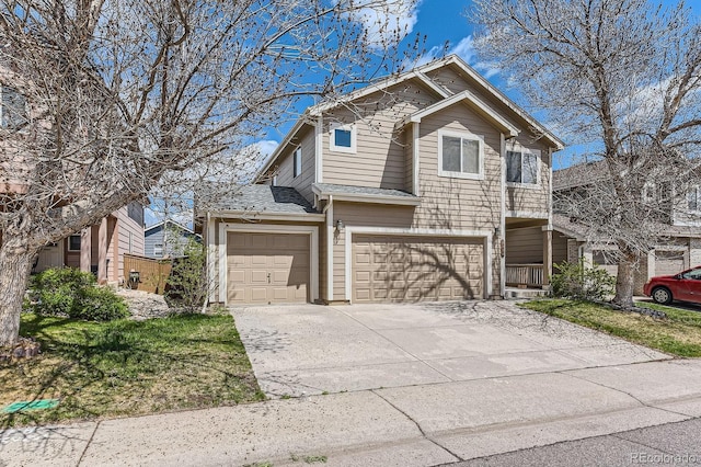 view of front facade with a garage and concrete driveway