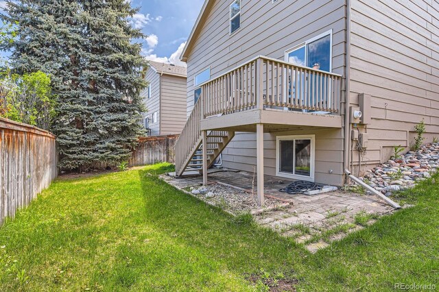 back of house with a wooden deck, stairs, and a patio area