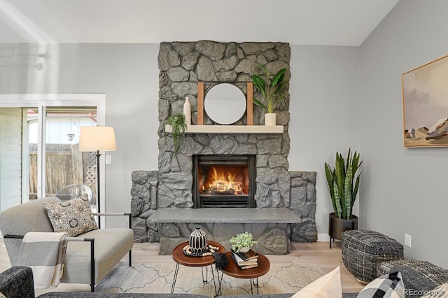 living room featuring a fireplace and hardwood / wood-style floors