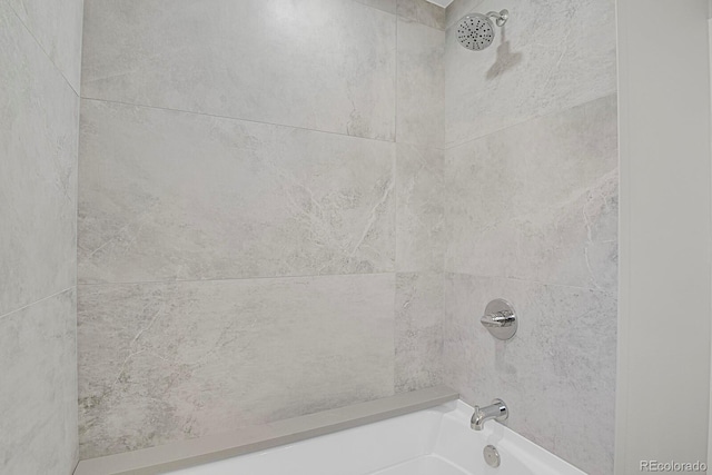 interior details with tiled shower / bath