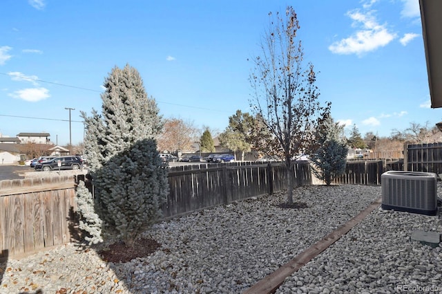 view of yard with central air condition unit