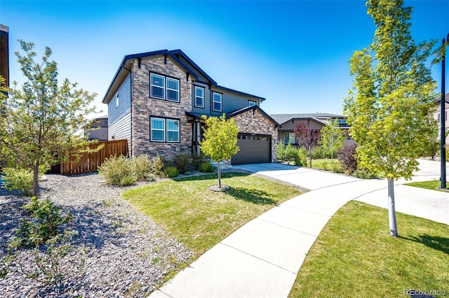 view of front of property featuring a garage and a front lawn