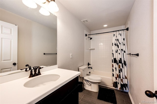 full bathroom with tile patterned floors, shower / bath combination with curtain, toilet, and vanity